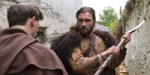 Vikings' Rollo greets a monk in the traditional Viking way.