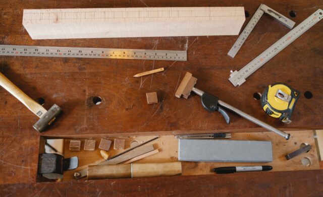 tools of joiner placed on wooden table
